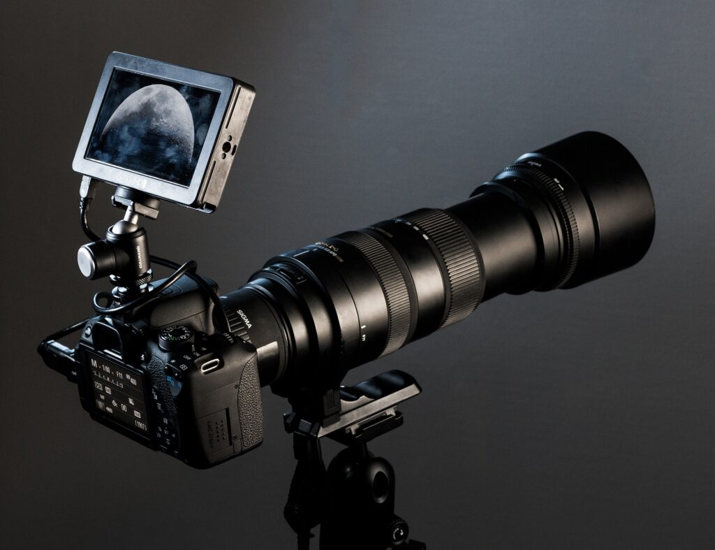 Guest photographing elephants at sunset during a luxury photography safari in Africa.