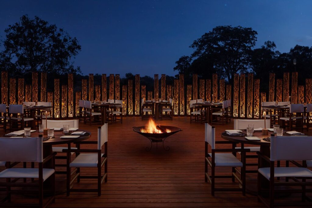 Travelers around a safari boma fire under the stars – Safari Glossary by Oloi Shorua