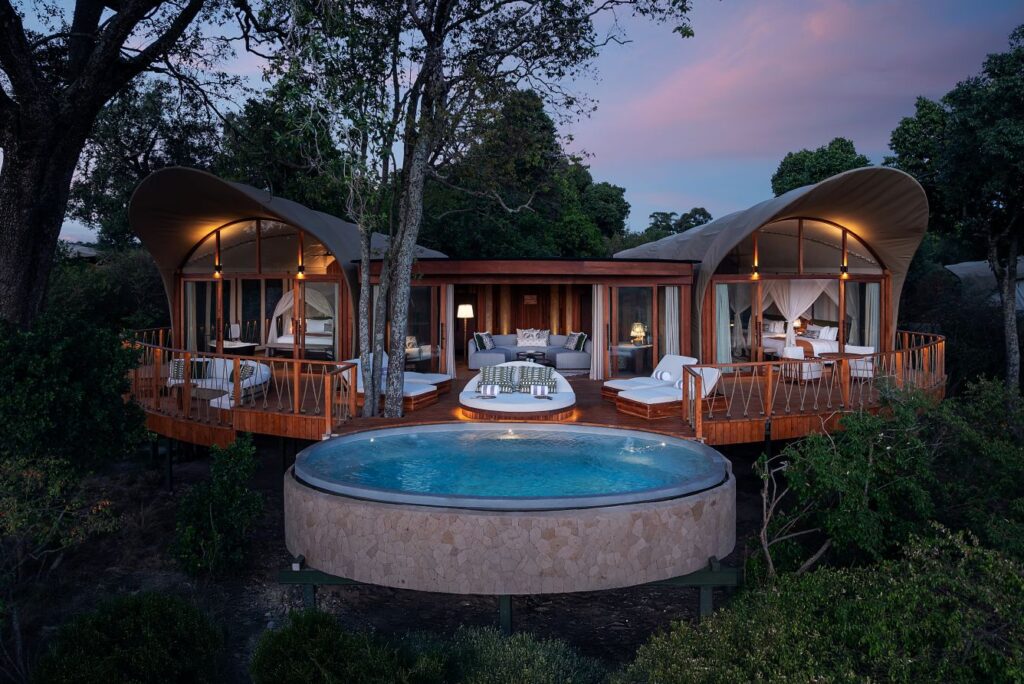Luxury safari lodge in Africa with private pool and savannah views at sunset